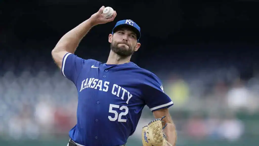 Seattle Mariners vs Kansas City Royals Picks and Predictions June 30th 2025 2 A pitcher in a blue Kansas City jersey winds up to throw a baseball, showcasing athletic intensity and focus on the mound.