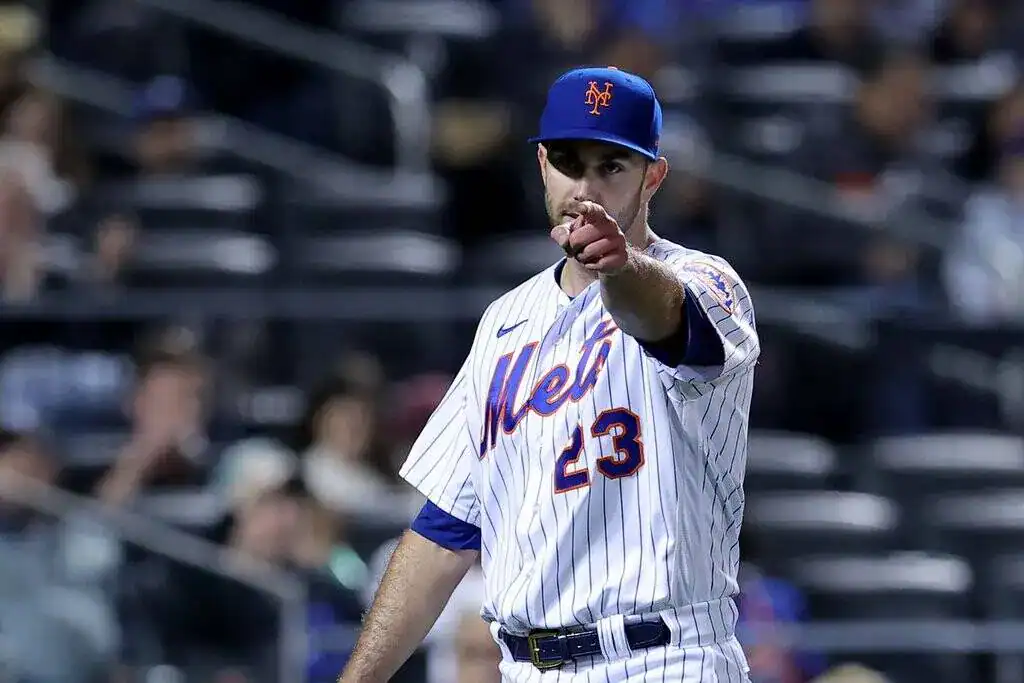 Pittsburgh Pirates vs New York Mets Picks and Predictions June 27th 2025 2 A baseball player in a Mets uniform and cap points forward with a determined expression.