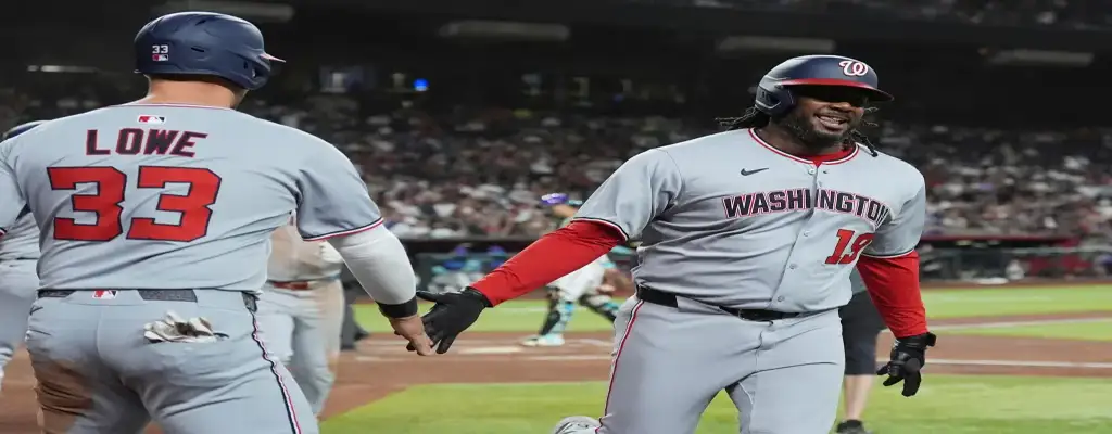 Los Angeles Angels vs Washington Nationals Picks and Predictions June 28th 2025 2 Washington Nationals player smiles while high-fiving teammate after scoring a run
