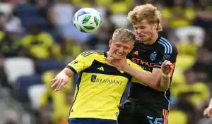 New England Revolution and Nashville SC players battle for the ball during MLS game on June 25th 2025