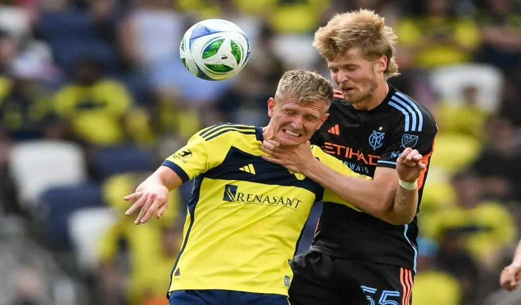 New England Revolution and Nashville SC players battle for the ball during MLS game on June 25th 2025
