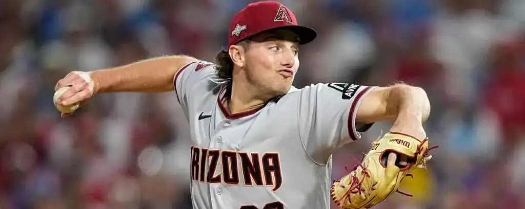 Atlanta Braves vs Arizona Diamondbacks Picks and Predictions June 5th 2025 2 A pitcher in a gray Arizona Diamondbacks jersey prepares to throw a baseball, showcasing athleticism and focused concentration.