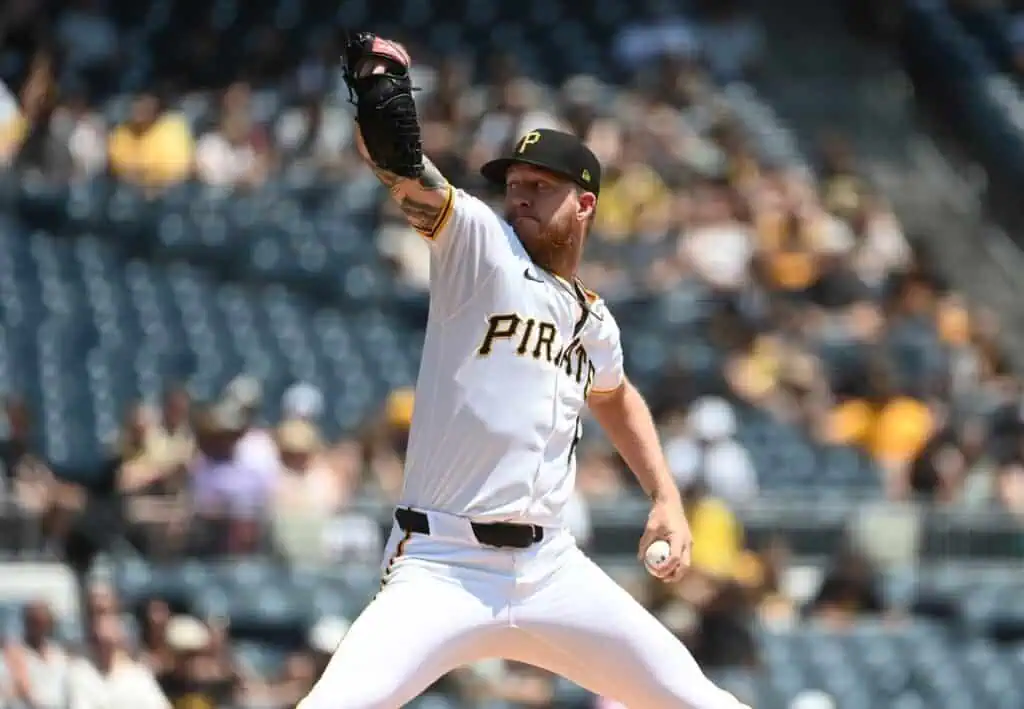 A Pittsburgh Pirates pitcher winds up to throw a pitch during a sunny day at the baseball stadium