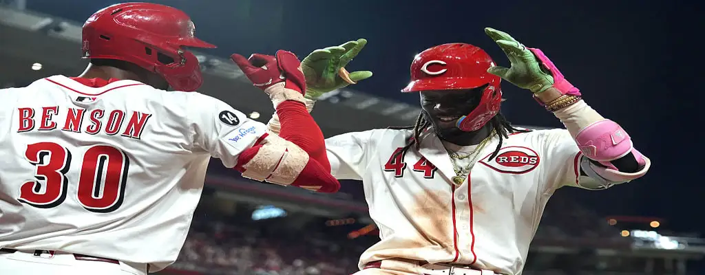 Cincinnati Reds vs San Diego Padres Picks and Predictions June 28th 2025 3 Cincinnati Reds players Benson and De La Cruz celebrate a run with a high-energy high five