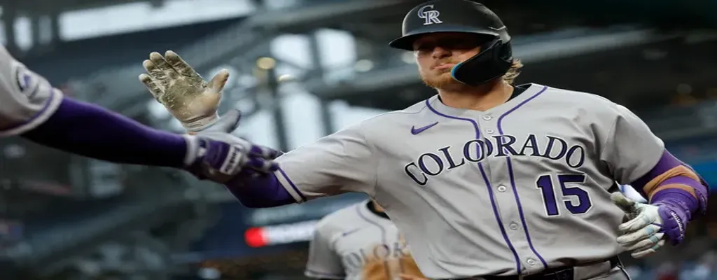 Milwaukee Brewers vs Colorado Rockies Picks and Predictions June 27th 2025 2 Colorado Rockies player gives high five after scoring a run
