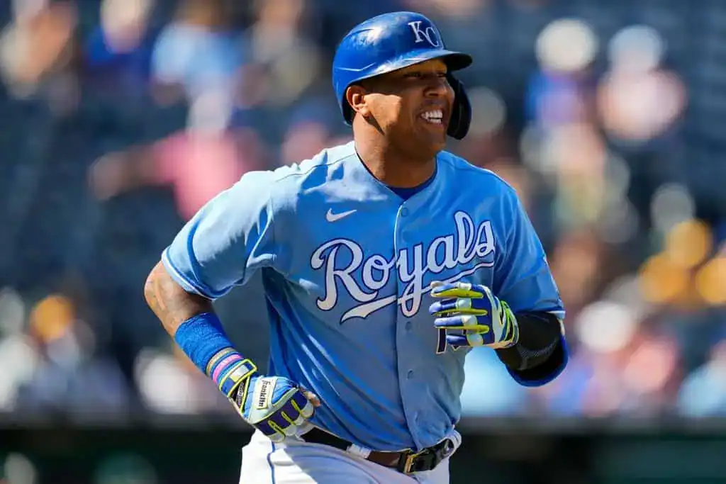 Texas Rangers vs Kansas City Royals Picks and Predictions June 18th 2025 2 A Kansas City Royals player in a bright blue jersey runs on the field, showcasing vibrant batting gloves and a focused expression.