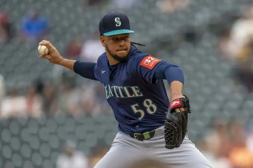 Seattle Mariners pitcher Luis Castillo, number 58, throws a pitch during a game.