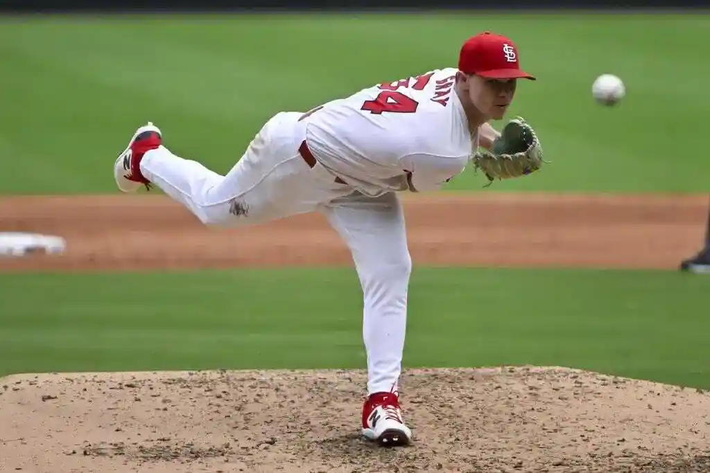 Cleveland Guardians vs St. Louis Cardinals Picks and Predictions June 27th 2025 2 Baseball player in white uniform and red cap pitches on a mound.