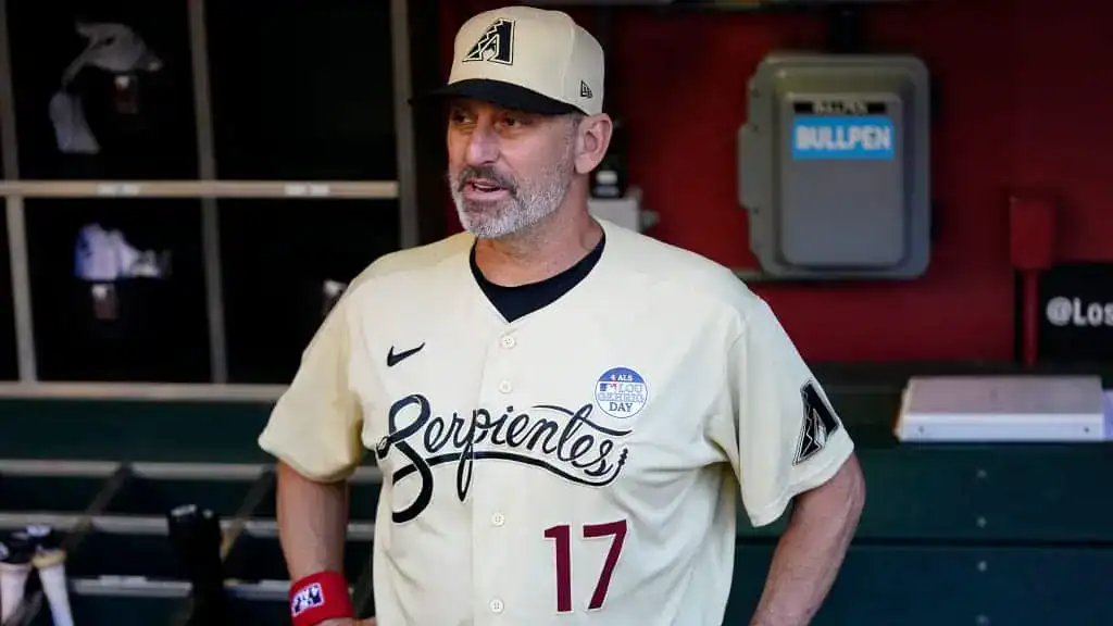 Arizona Diamondbacks vs Miami Marlins Picks and Predictions June 29th 2025 2 A baseball player in a cream jersey with "Serpientes" printed and the number 17 stands in a dugout, ready for the game.