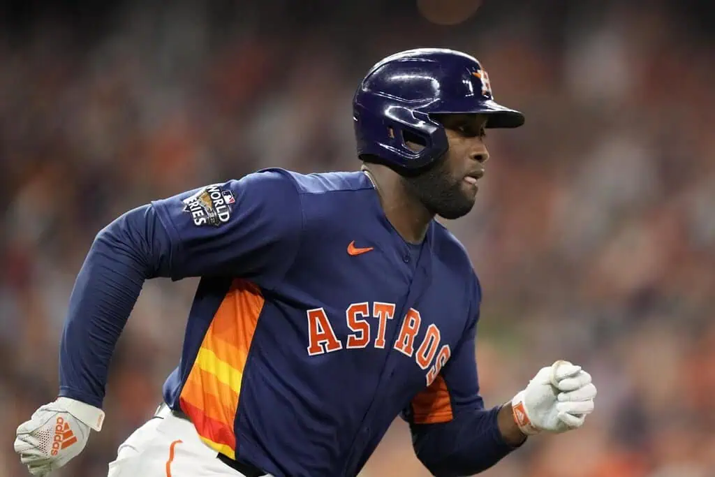 Houston Astros vs Philadelphia Phillies Picks and Predictions June 25th 2025 2 A baseball player in an Astros jersey runs on the field during a World Series game, showcasing team colors and determination.