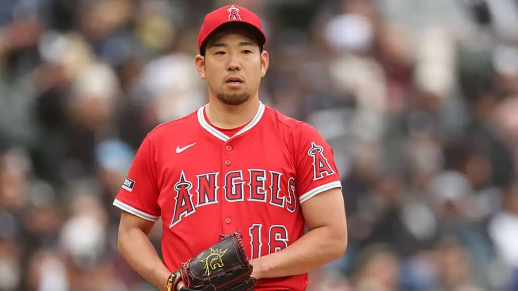 Los Angeles Angels vs Houston Astros Picks and Predictions June 20th 2025 2 A player in a red Los Angeles Angels jersey, number 16, stands on the mound, ready to pitch in a baseball game.