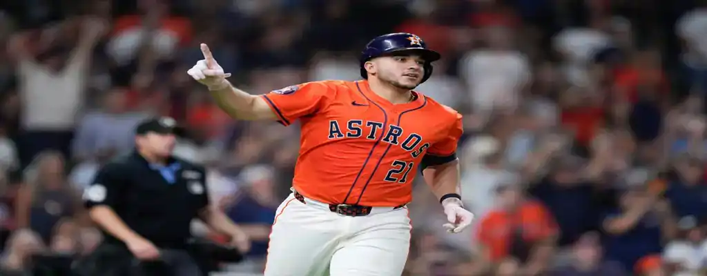 Pittsburgh Pirates vs Houston Astros Picks and Predictions June 5th 2025 2 Houston Astros player celebrates a home run by pointing upward, wearing an orange jersey and navy helmet with the crowd cheering behind.