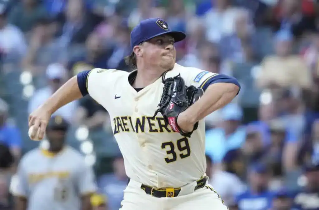 A Milwaukee Brewers pitcher, wearing number 39, throws a pitch during a game.