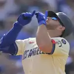 Los Angeles Dodgers player celebrates after scoring during matchup with New York Mets on June 4, 2025