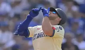 Los Angeles Dodgers player celebrates after scoring during matchup with New York Mets on June 4, 2025