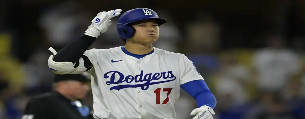 Los Angeles Dodgers vs Washington Nationals Picks and Predictions June 20th 2025 3 Los Angeles Dodgers player in white uniform gestures during an MLB game