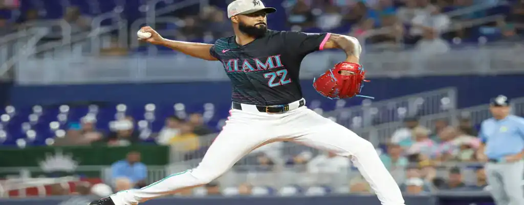 Tampa Bay Rays vs Miami Marlins Picks and Predictions June 7th 2025 2 Miami Marlins pitcher delivers a pitch with full extension, wearing the team's black and pink uniform during a home game.