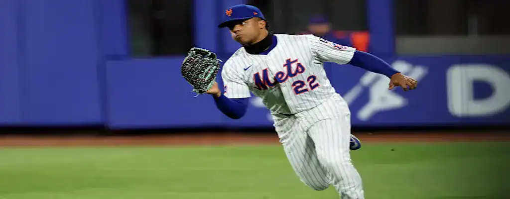 New York Mets fielder running to catch a ball during an MLB game
