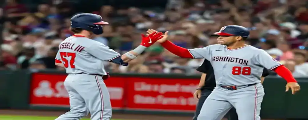 Washington Nationals vs Texas Rangers Picks and Predictions June 7th 2025 3 Washington Nationals players celebrate a run with a high-five, wearing gray road uniforms during a game.