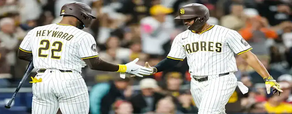 Milwaukee Brewers vs San Diego Padres Picks and Predictions June 7th 2025 2 San Diego Padres teammates Heyward and another player high five after a successful play