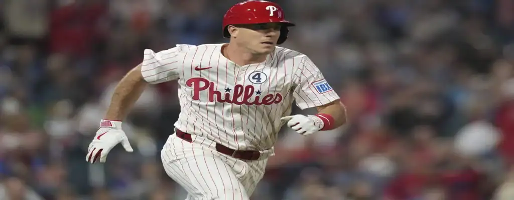 Philadelphia Phillies vs New York Mets Picks and Predictions June 20th 2025 3 Philadelphia Phillies player in white pinstripe uniform running during an MLB game