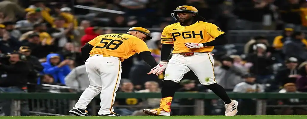 Chicago Cubs vs Pittsburgh Pirates Picks and Predictions June 12th 2025 2 Pittsburgh Pirates players in yellow uniforms celebrate during an MLB night game