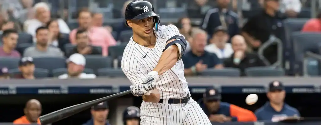 Kansas City Royals vs New York Yankees Picks and Predictions June 12th 2025 2 New York Yankees batter in pinstripe uniform swings at a pitch during an MLB game