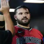 Arizona Diamondbacks player celebrates with teammate during game against the Kansas City Royals.