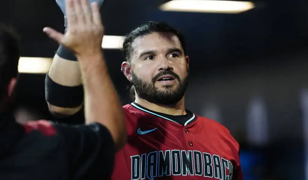 Arizona Diamondbacks player celebrates with teammate during game against the Kansas City Royals.