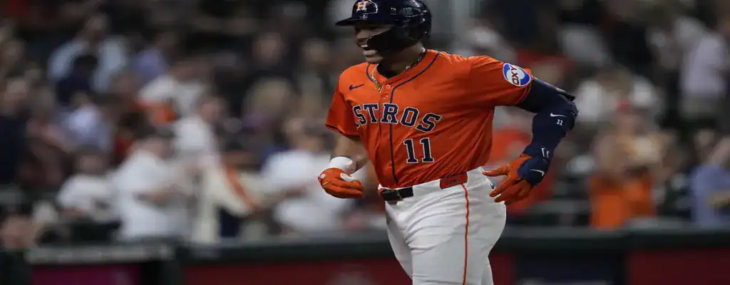  Houston Astros player celebrating during a night game