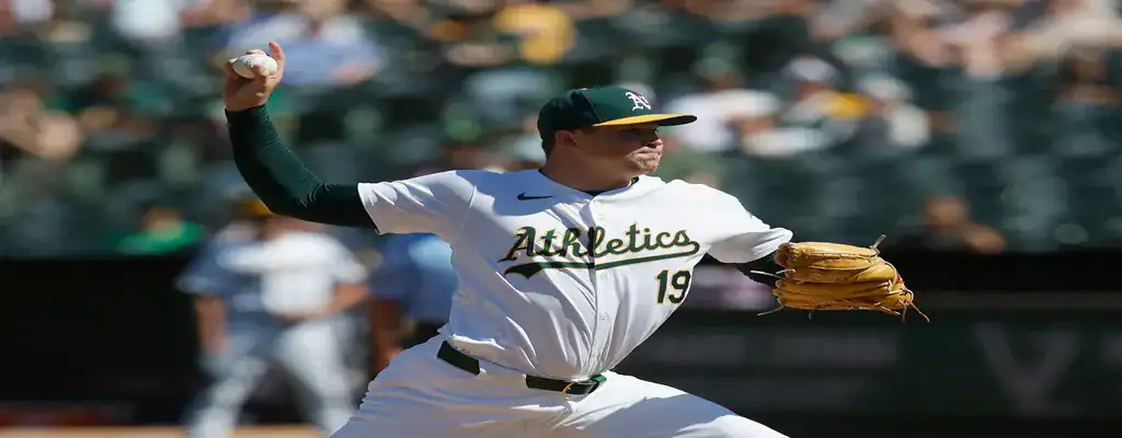 Oakland Athletics pitcher unleashing a strong pitch during a game