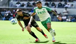 Austin FC and LAFC players racing for the ball during MLS match action