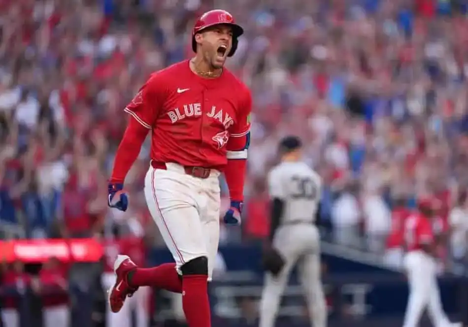 Toronto Blue Jays baseball player running around the base after batting.