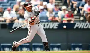 Baltimore Orioles batter making contact against the Colorado Rockies on July 25, 2025