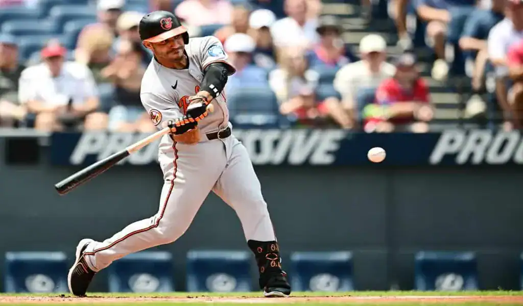 Baltimore Orioles batter making contact against the Colorado Rockies on July 25, 2025