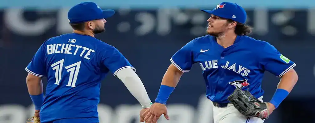 Detroit Tigers vs Toronto Blue Jays Picks and Predictions July 24th 2025 2 Toronto Blue Jays players celebrating a defensive play together