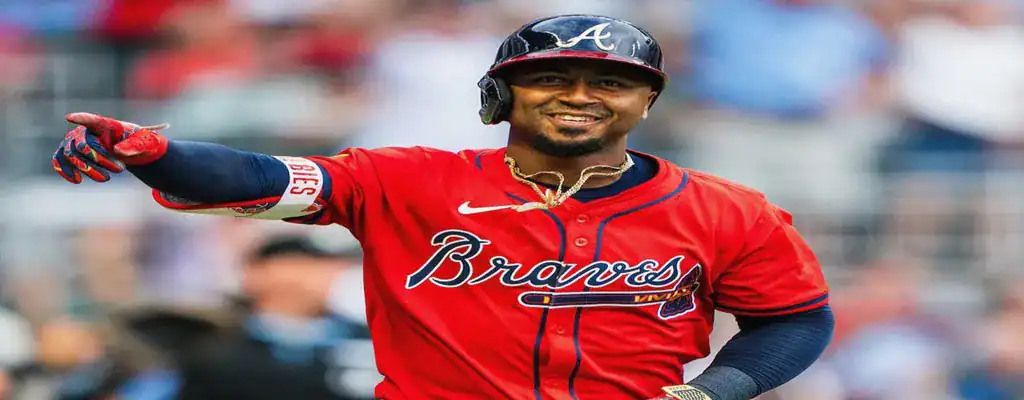 Atlanta Braves player smiling and pointing during a baseball game