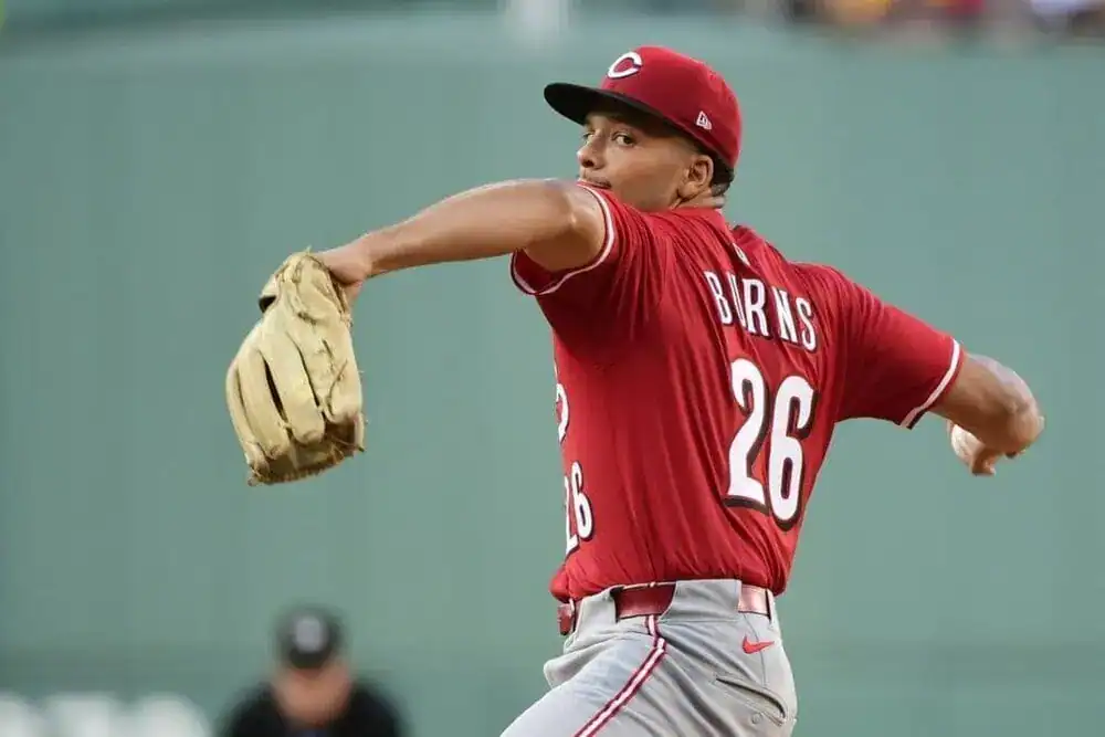 baseball player wearing a red uniform, identified as C Burns with the number 26 on his jersey.