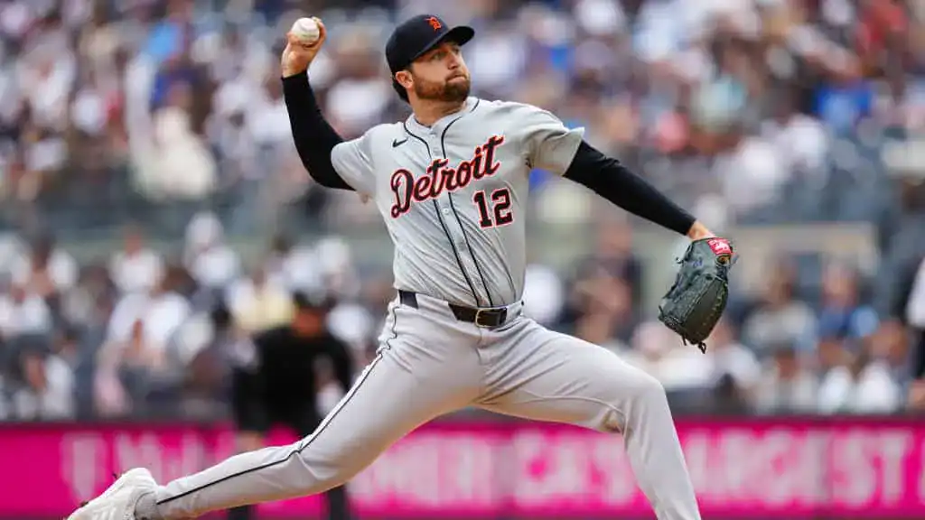 Detroit Tigers vs Seattle Mariners Picks and Predictions July 12th 2025 2 A baseball pitcher in a gray Detroit Tigers uniform winds up to throw a pitch, with fans in the blurred background.