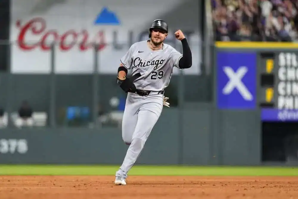 The player is wearing a baseball uniform, equipped with essential gear like a glove, emphasizing their role in the sport.