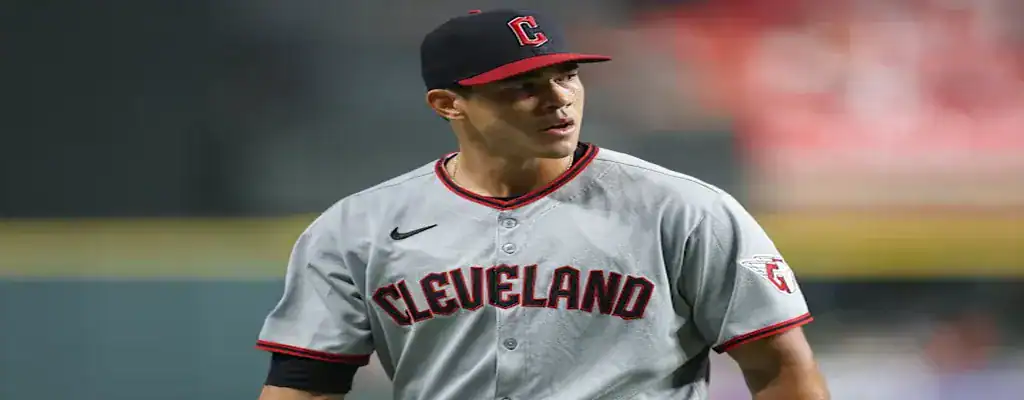 Cleveland Guardians pitcher focused during a tense baseball game
