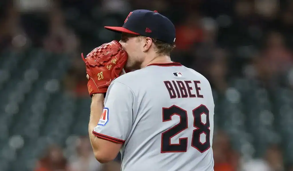 Cleveland Guardians pitcher preparing to throw a pitch during a game against the Baltimore Orioles
