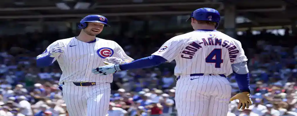 Minnesota Twins vs Chicago Cubs Picks and Predictions July 10th 2025 2 Chicago Cubs players celebrating at home plate after a successful run