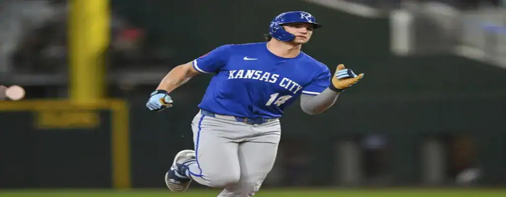 Kansas City Royals player sprinting after a hit during a game