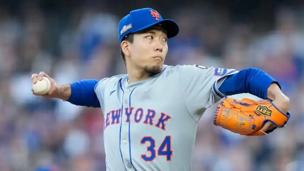 New York Mets vs. Kansas City Royals Picks and Predictions July 11th 2025 2 A baseball player is seen throwing a ball in an outdoor setting, likely at a baseball park.