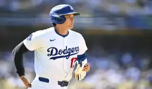Los Angeles Dodgers player focused while running the bases during a matchup against the Minnesota Twins