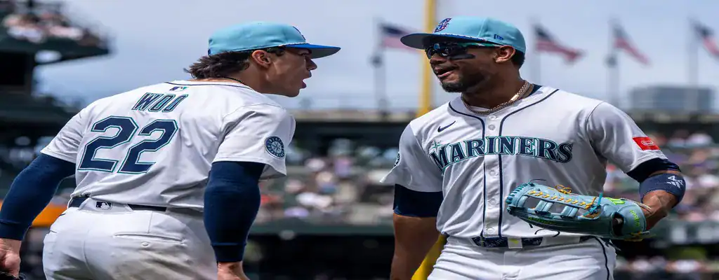 Seattle Mariners vs Milwaukee Brewers Picks and Predictions July 21st 2025 3 Two Seattle Mariners players interacting during a baseball game