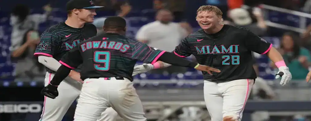 Miami Marlins vs San Diego Padres Picks and Predictions July 21st 2025 3 Miami Marlins players celebrating during a baseball game
