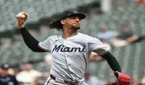 Miami Marlins pitcher delivering a pitch during a matchup against the San Diego Padres