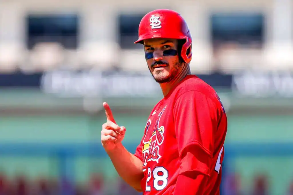 St. Louis Cardinals vs Atlanta Braves Picks and Predictions July 12th 2025 2 A baseball player in a red St. Louis Cardinals jersey gestures with his finger raised, signaling during a game on a sunny day.
